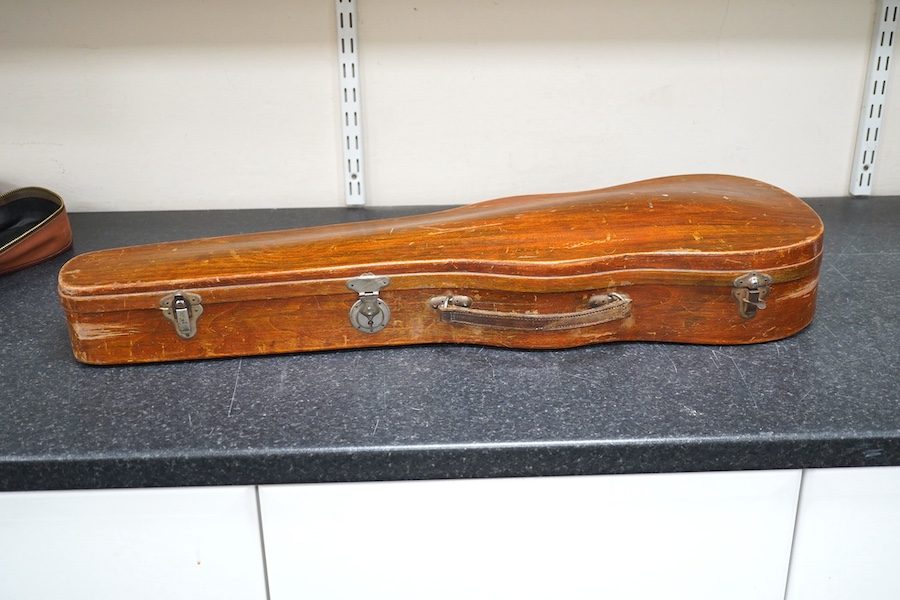 A cased violin, possibly German, body 35.5cm, in a good wooden case with canvas outer cover. Condition - fair